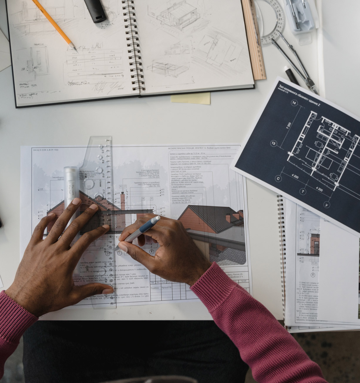 Construction professionals reviewing blueprints on site